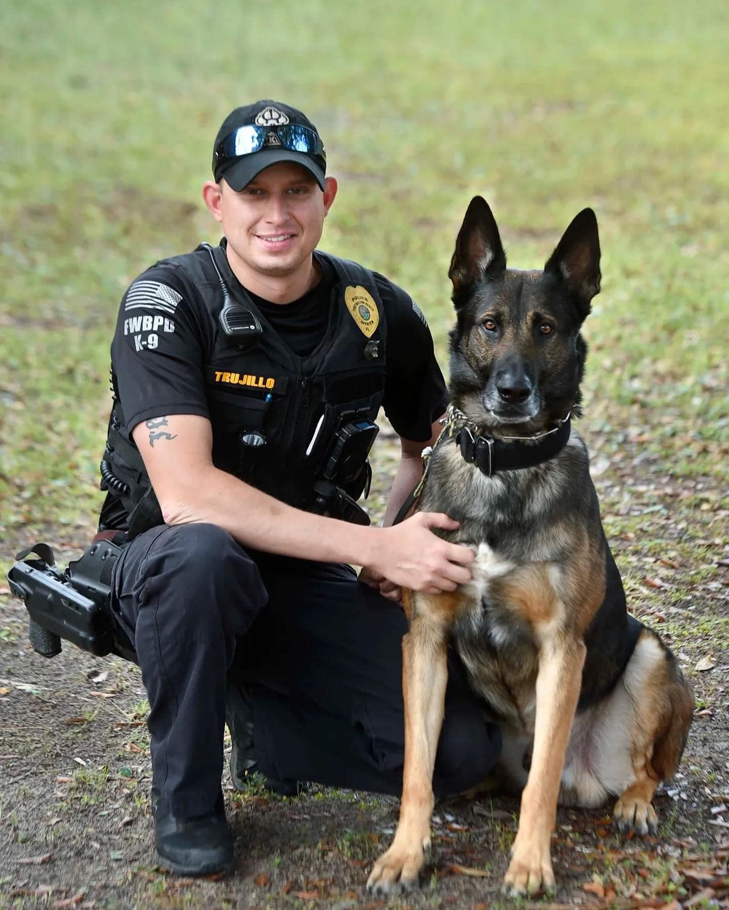 police officer posing with police dog