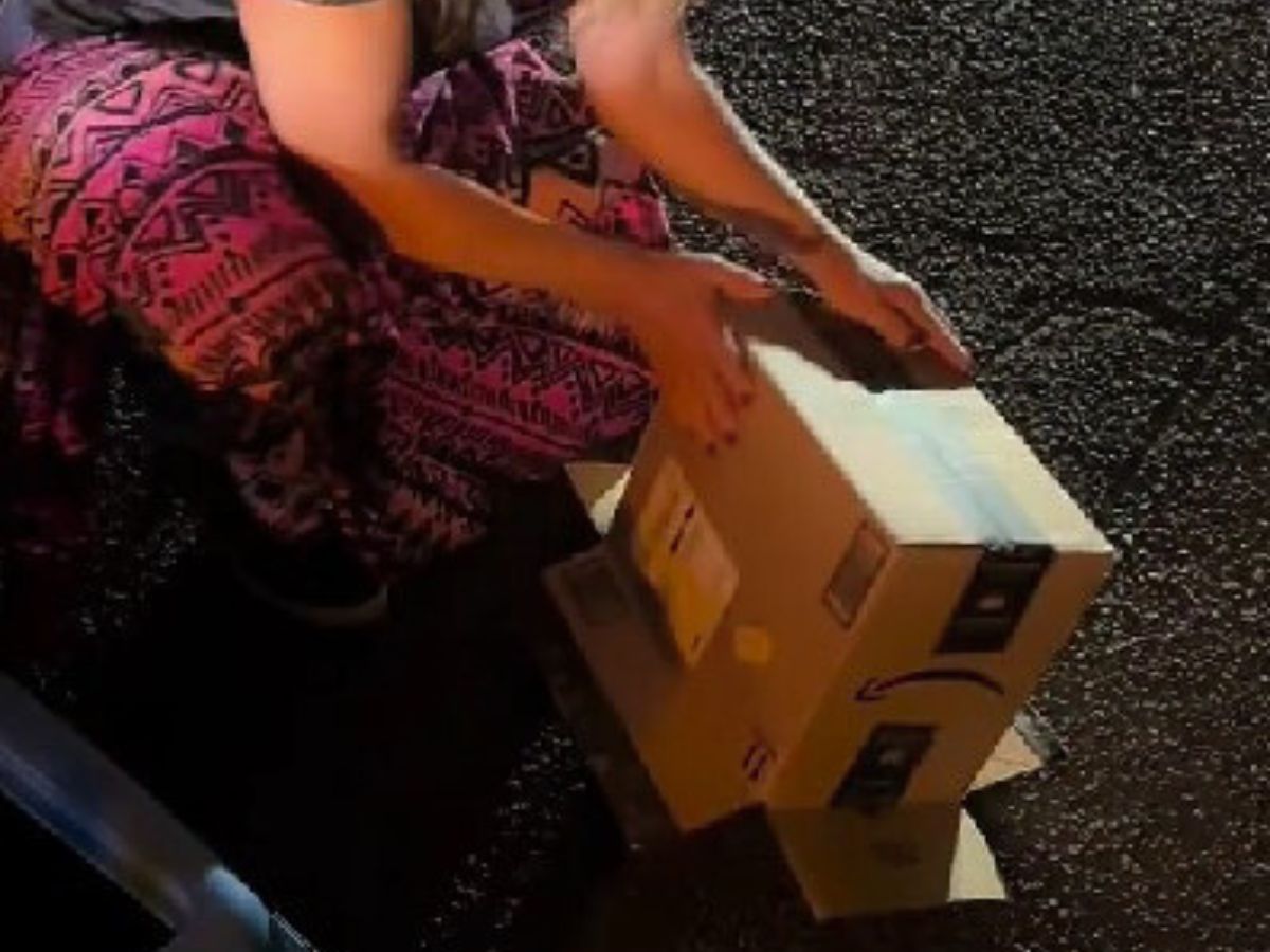 woman holding a box