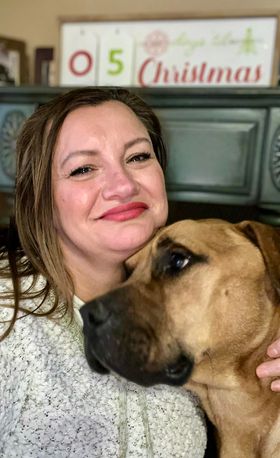 close-up photo of woman and a dog