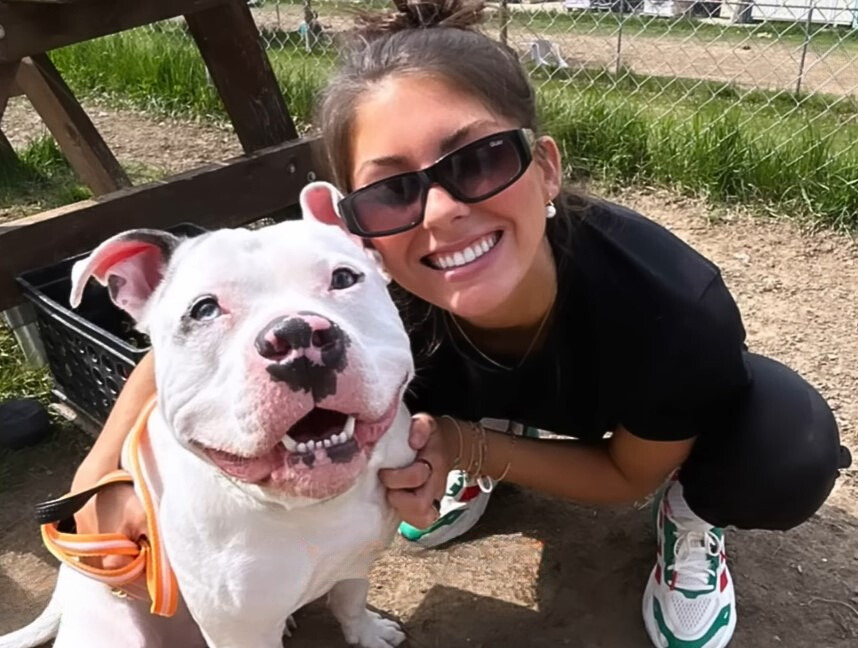 happy woman posing with smiling dog