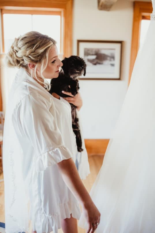 a girl celebrates her wedding with her dog