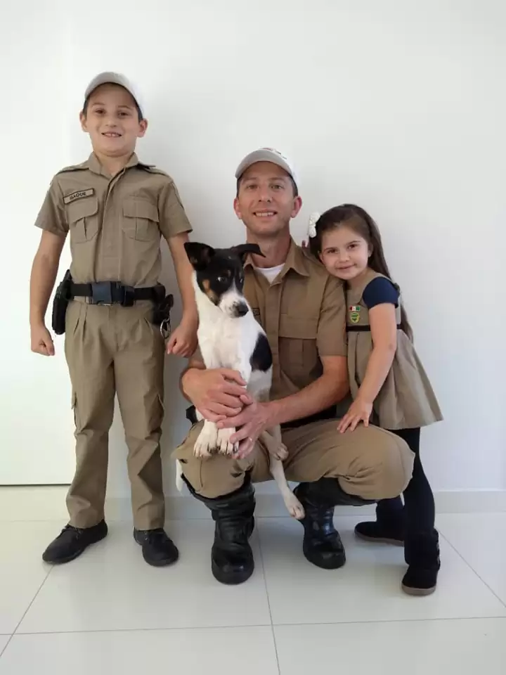 military kid with man and little girl and a dog