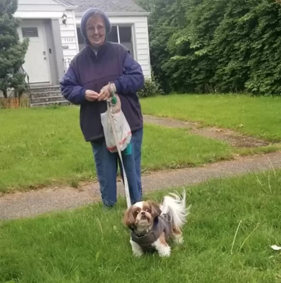 old woman walking her dog