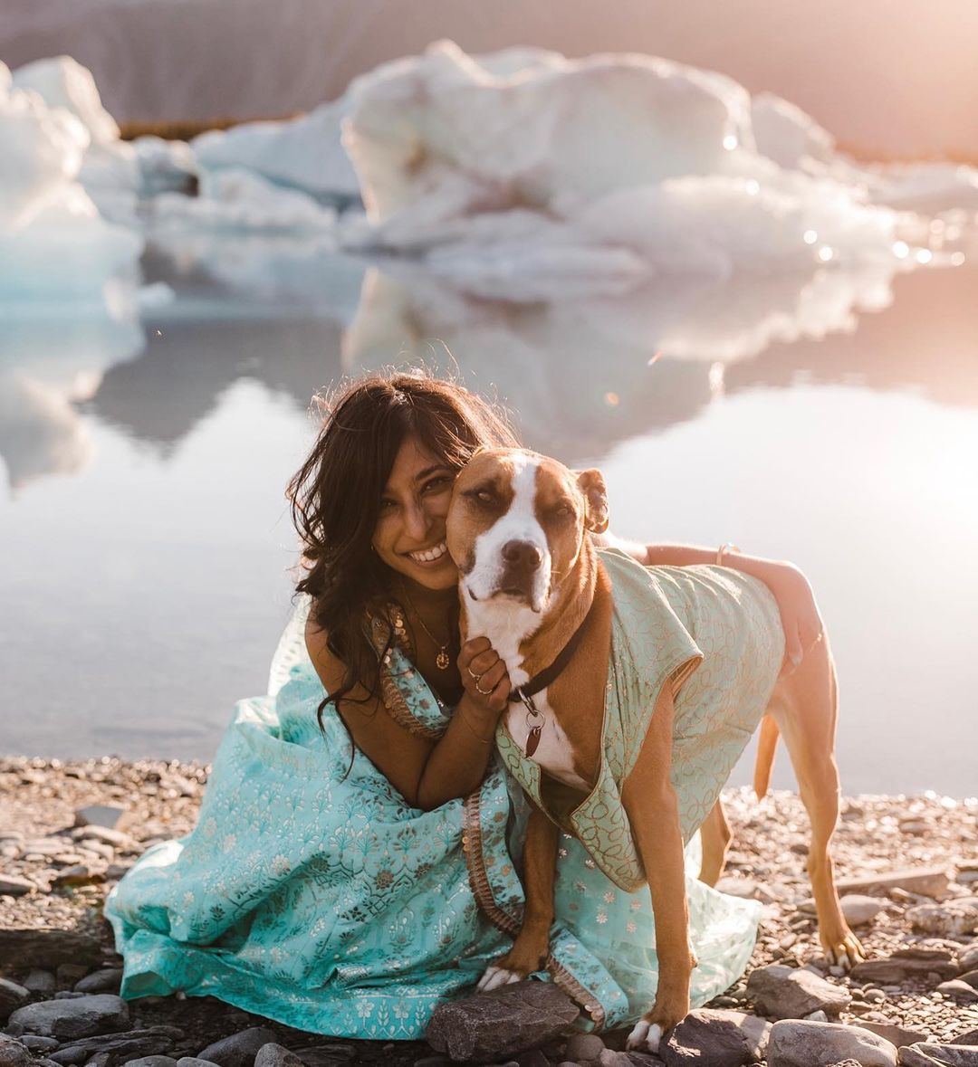 girl and dog near lake