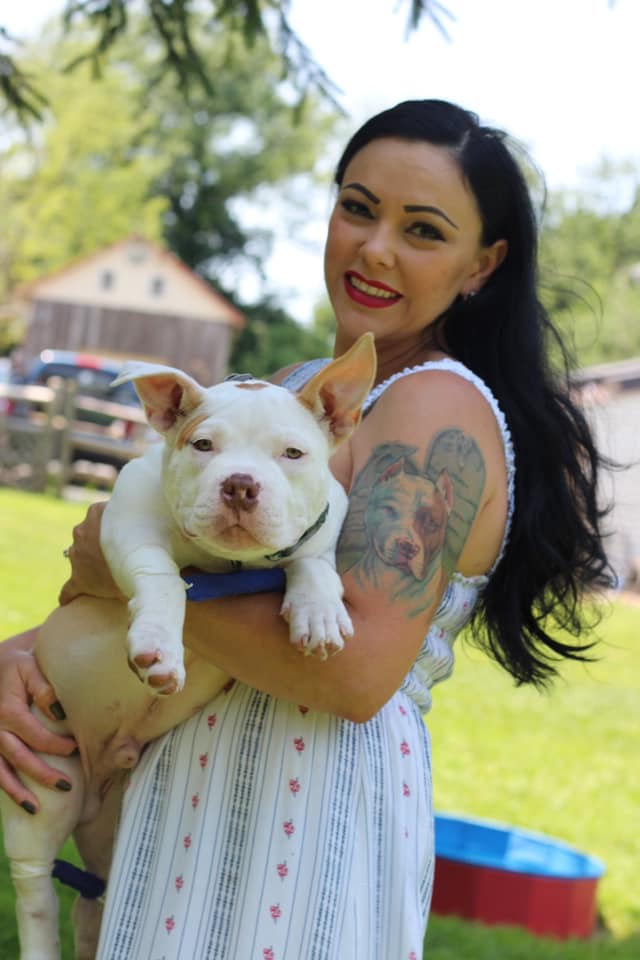 woman holding a pitbull